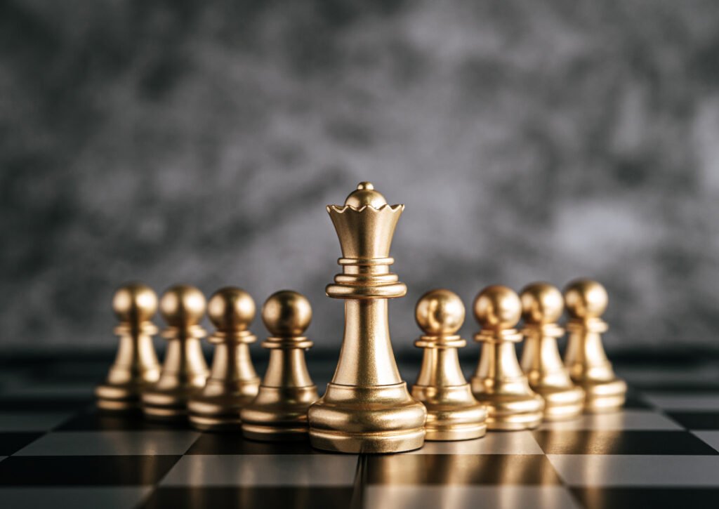 Gold Chess on chess board game for business metaphor leadership